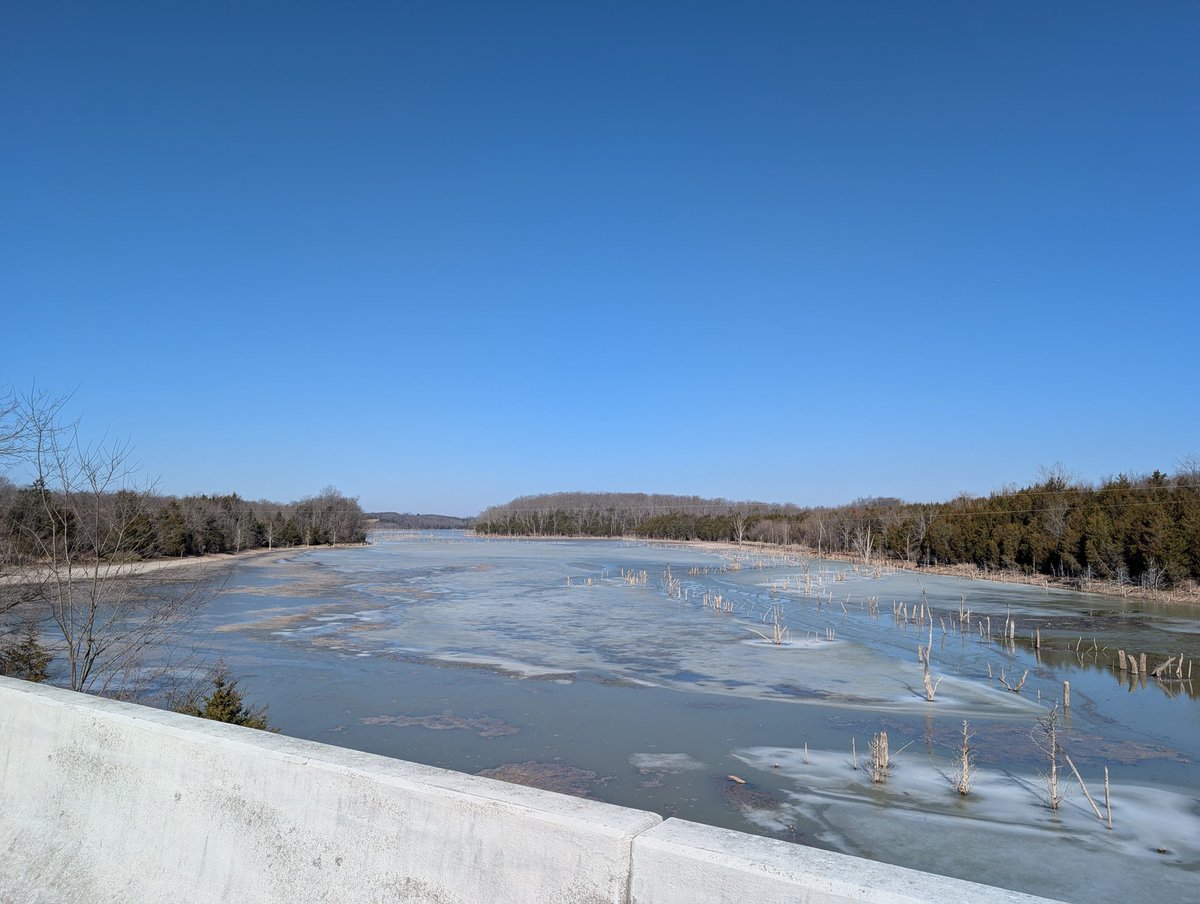 Cedar Creek Lake is still covered in ice as of 2/13. The forecast rain and warmer temps will help melt it, so hopefully it won't be too much longer.