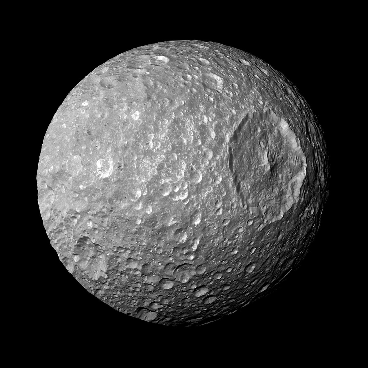 "That's no moon." 

#OTD in 2010, Cassini captured this view of Saturn's moon Mimas. The large Herschel Crater on the right gives Mimas some major Death Star vibes. #StarWars