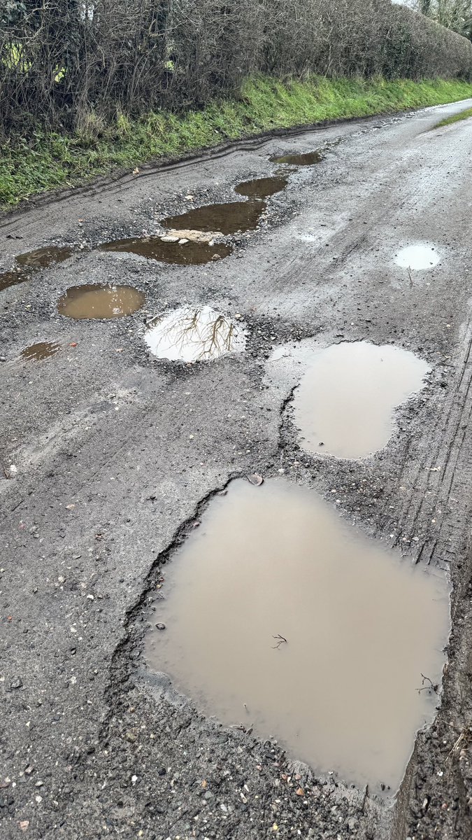 jpmercer's tweet photo. @BBCWatchdog just wondering if you’d like to do a story on potholes in Staffordshire and how little SBC actually do about it. 76 in 1/4 mile on my lane. Couple of samples to try and negotiate every day. https://t.co/4FO2hxiHwv