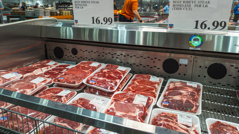 uniteonenation's tweet photo. Ever wonder why your burger costs more than gas these days? Let’s trace it back. JBS—Brazil’s meat empire, built by the Batista brothers—has a rap sheet longer than a cattle drive. Bribery scandals in Brazil? Check: $3.2 billion fine, payoffs to 1,900+ politicians, even SEC slaps for foreign corruption tied to U.S. acquisitions. Yet they own the biggest chunk of America’s meatpacking game—controlling beef, pork, poultry lines from feedlot to fork. 
Look at the numbers: U.S. beef prices spiked 13.9% last year, heading for another 6.9% jump in 2026. Sure, drought and herd shrinks play in—but when four giants (JBS, Tyson, Cargill, National) process nearly half the nation’s beef, market power whispers louder than supply chains. Tight cattle? Or just tighter margins for ranchers while packers cash in?
Take a peek at these lines: workers carving up carcasses in massive plants…

…and your local grocery shelf staring back with ribeyes at $16+ a pound.

The Batistas? Still billionaires, still steering from the shadows.

And prices? Ground beef hovering around six bucks a pound now—up 50% since 2020. Coincidence? Or consolidation?
So ask yourself: Is this just ‘supply and demand’? Or are we paying premium for a system where one foreign-owned giant calls the shots—while ranchers scrape by and families skip steak? Who’s really profiting… and why does it feel like we’re the ones getting butchered?