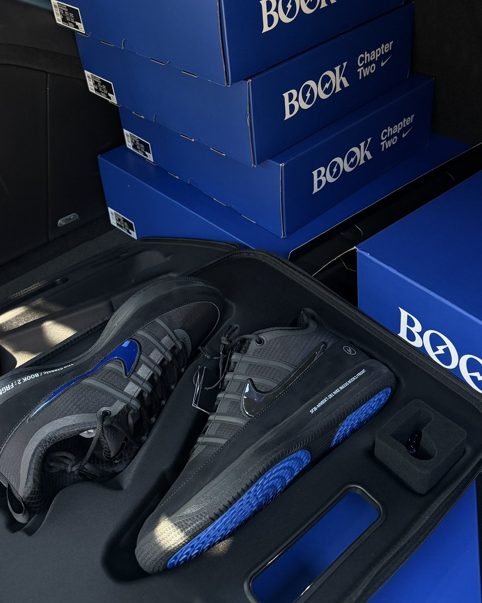 Devin Booker and Hiroshi Fujiwara are signing boxes of the