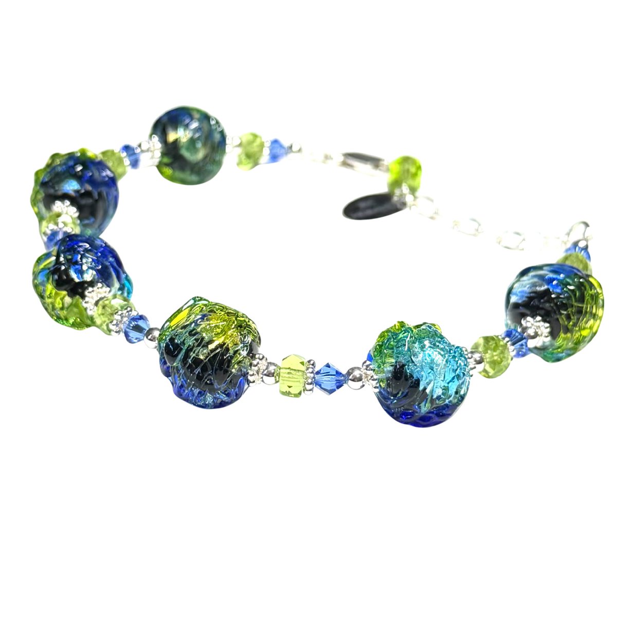 New in the shop 💙💚
Artisan Blue Green Murano Glass Bracelet with encased sterling silver. Cobalt, aqua &amp; lime tones shimmer in authentic Italian glass. Finished with sterling silver and extender chain. jkcmurano.com/products/muran…

Shop now: jkcmurano.com

#MuranoGlass