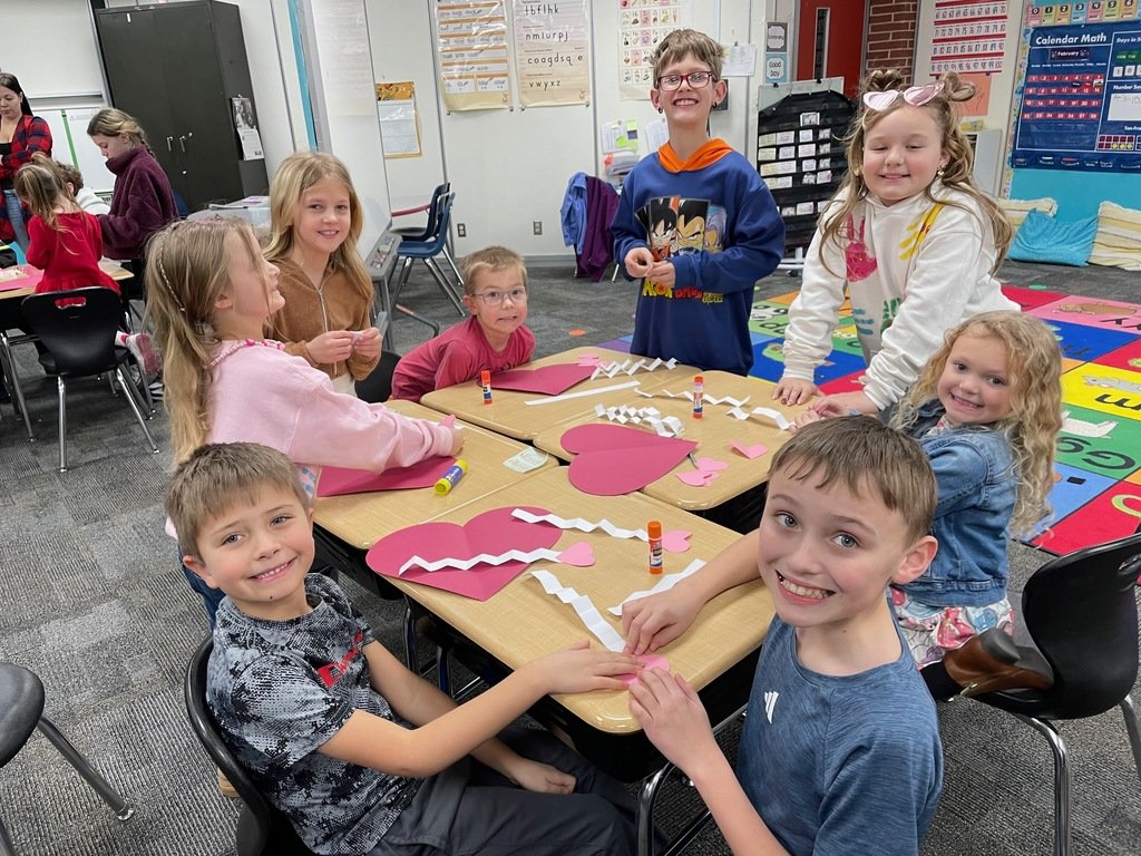 4th and Kindergarten making a Valentine’s Day craft.