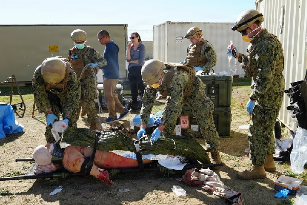 SOTorg's tweet photo. ERSS TRAINING EMPHASIZES SUPPLY MANAGEMENT IN AUSTERE ENVIRONMENTS FOR EXPEDITIONARY MEDICINE

CAMP PENDLETON, CALIFORNIA, UNITED STATES, (January 27, 2026):  Cmdr. Daniel Fay (right), an emergency room physician, Lt. Ryan Buyeske (center), an emergency room nurse, and Hospital Corpsman 3rd Class Rian Meeks (left), a respiratory therapist, all assigned to Expeditionary Resuscitative Surgical System (ERSS) 21, Navy Reserve, package a simulated casualty for transport during an ERSS training at Camp Pendleton, California. The training, conducted by Naval Expeditionary Medicine Warfighter Development Center (NEMWDC), reinforces teamwork, patient movement, and efficient use of supplies in resource-constrained environments. (U.S. Navy photo by Petty Officer 2nd Class Leandra Mojica Rivera)

READ MORE: https://t.co/4NxSDDcT2x
DONATE: https://t.co/wFQuc0zwtb
 #supportourtroops #nonprofit #charity #military #activeduty #soldier #navy #Marines #Army #airforce #spaceforce