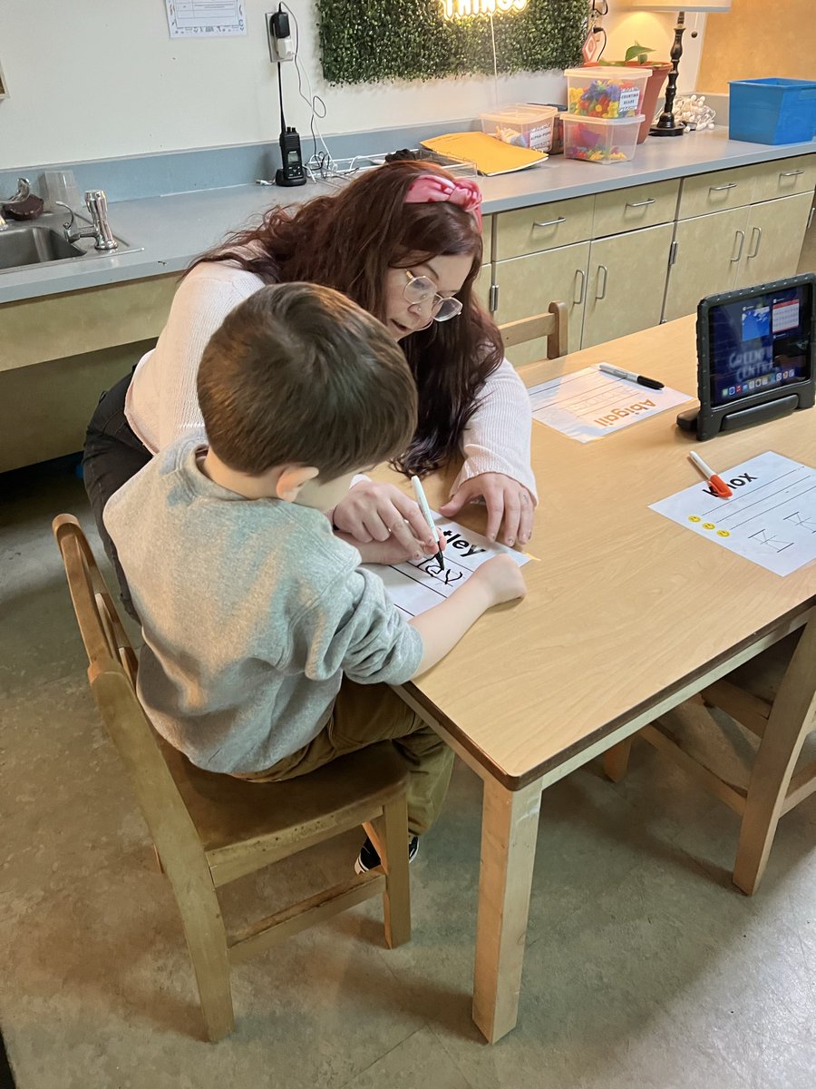 Ms. Martin is helping one of our Cougar Cubs with name work today!
