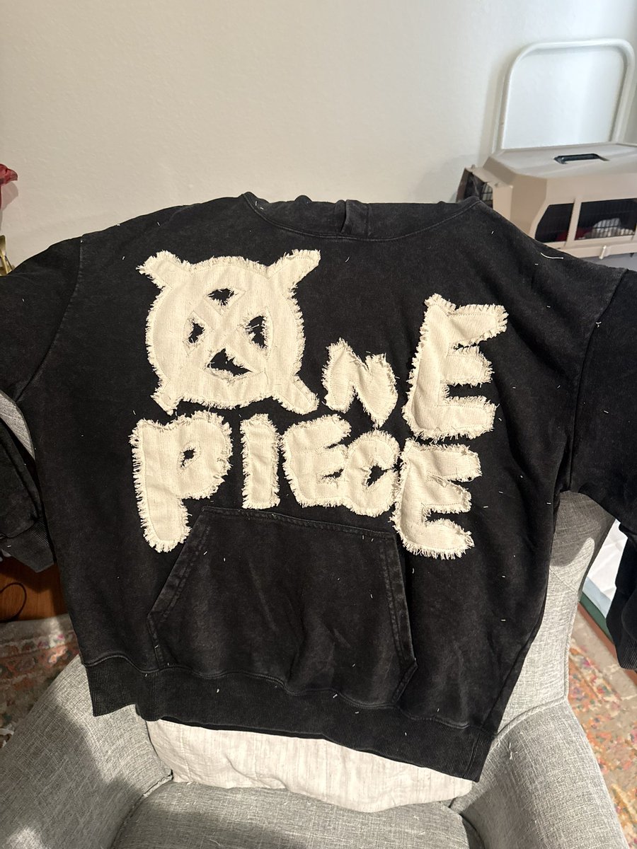 i added these thingies onto this hoodie !! i needto dry it so it frays more and gets rid of the stray pieces and maybe add a jolly roger onto the back :0