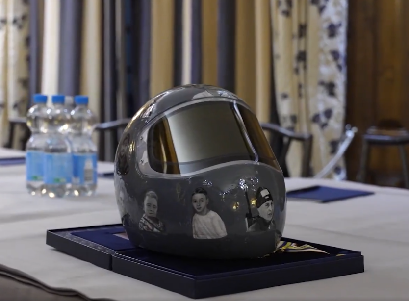 I only learned today, that these are painted portraits, not photographs. This helmet has been created with extraordinary skill, and love, and deep respect. It carries a profound message. It is a work of art in its own right, and will I know become a national treasure of Ukraine.