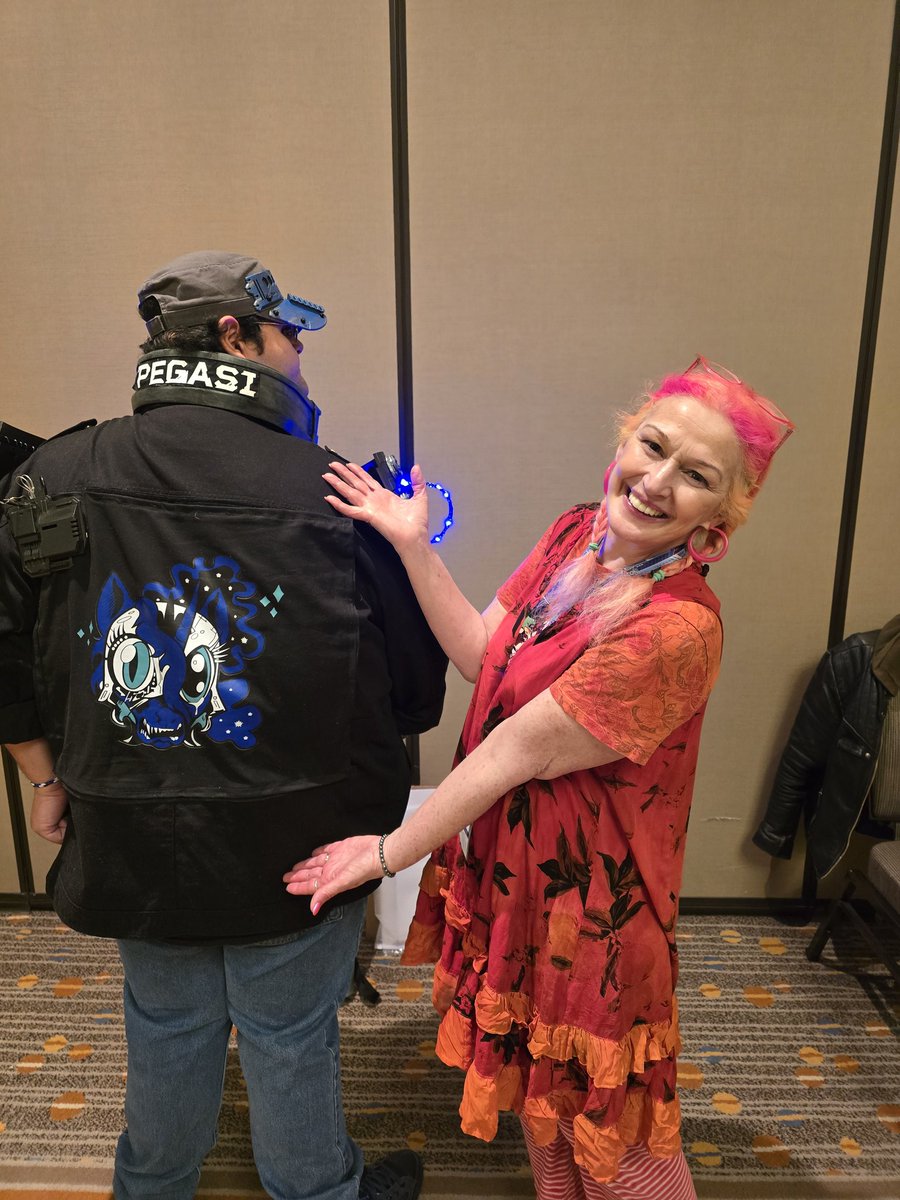 Got to meet <a href="/TabithaG67327/">Tabitha St Germain</a>  at harmonycon while wearing my cyberpunk themed nightmare, moon oni jacket based on the jacket from the game cyberpunk 2077 i also wanna thank the artist <a href="/LytletheLemur/">Andrew Lytle 🔜@Kickstarter Fulfillment</a> for the awesome image that he did for my jacket thank again bro <a href="/HarmonyPonyCon/">HarmonyCon Dallas</a>