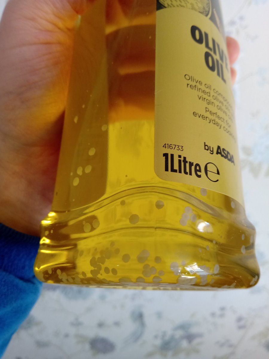 TheLUPOL's tweet photo. Is this olive oil mouldy or just cold? It's about a month out of date. #cookingtwitter @grok https://t.co/BHd56mKOY3
