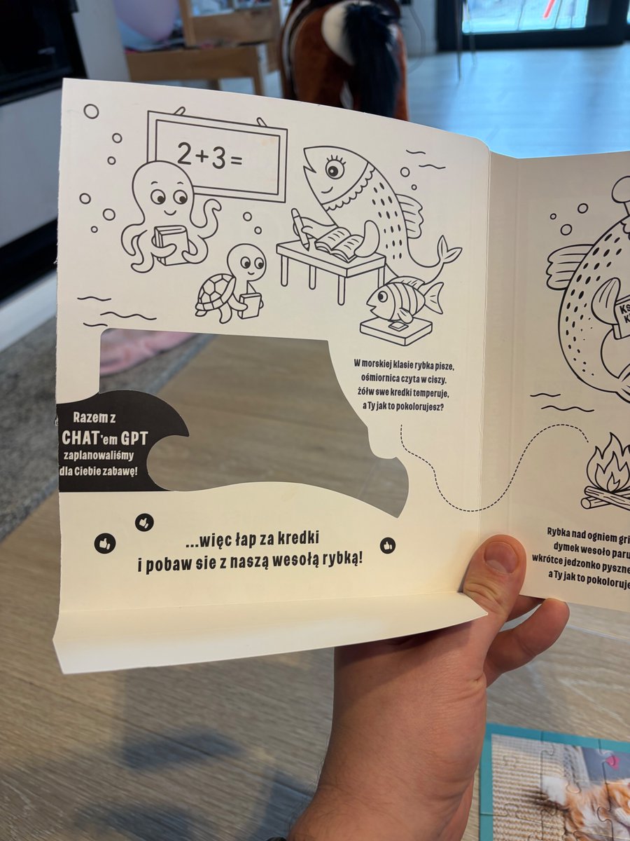 A pack of salmon, with a small coloring book inside. Text on black background says that it was prepared with ChatGPT. 

Future is now, I guess.