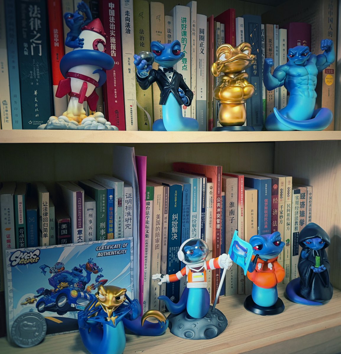 Most people don't leave crypto because they lost money.

They leave because they forgot how to enjoy it.

I just set up my <a href="/SnekFigures/">Snek Figures</a> on my dad's old bookshelf. His research materials are still there, untouched. Now SNEK stands guard over all of it.

These aren't just