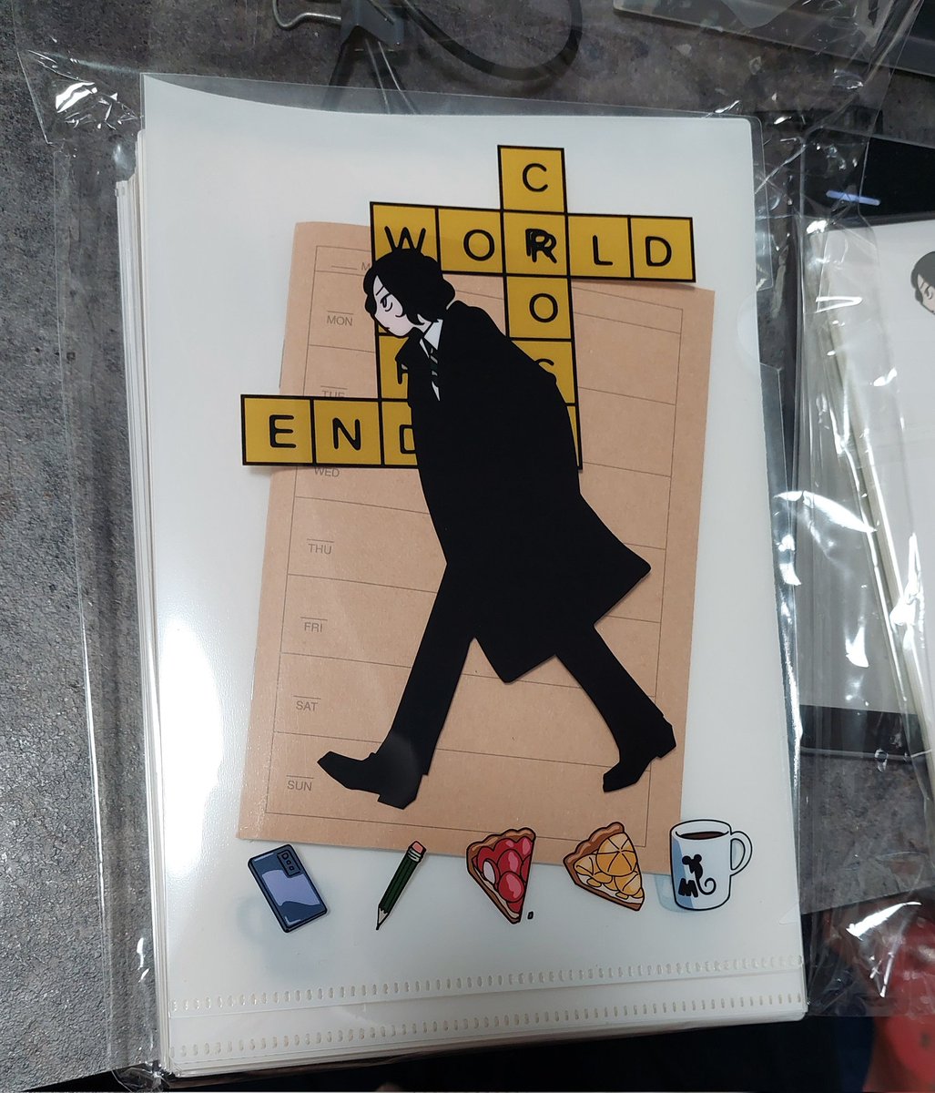 新刊セットのクリアファイルとシール。 クリアファイルは表だけ透け