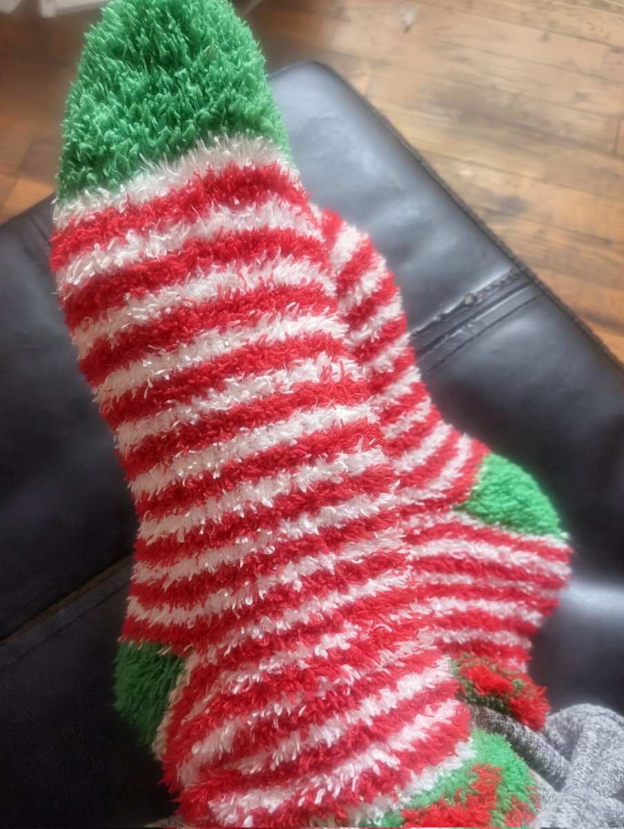 Shoshi's tweet photo. when you find a new pair of fluffy Christmas socks that you forgot about...universe showing love on this day. 😏❤️ https://t.co/VrBWhMwbod