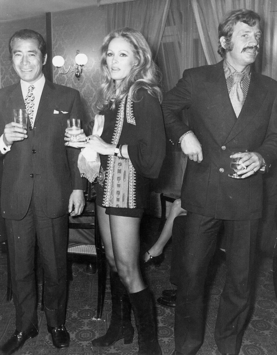 Toshiro Mifune, Ursula Andress and Jean-Paul Belmondo at a party following the Paris premiere of Red Sun (1971)