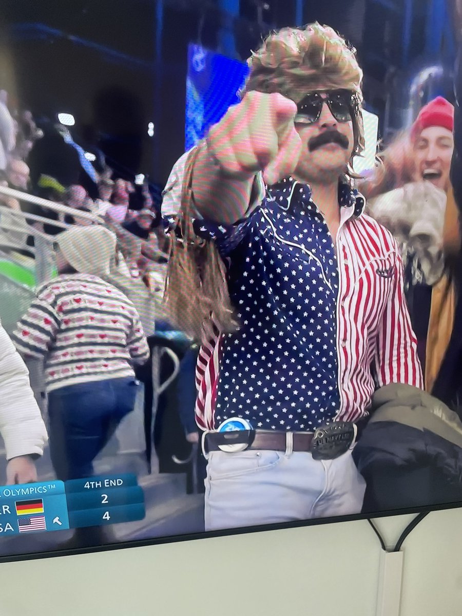 USA v Germany in curling and they pan to this guy. WITH THE ZYN HOLDER