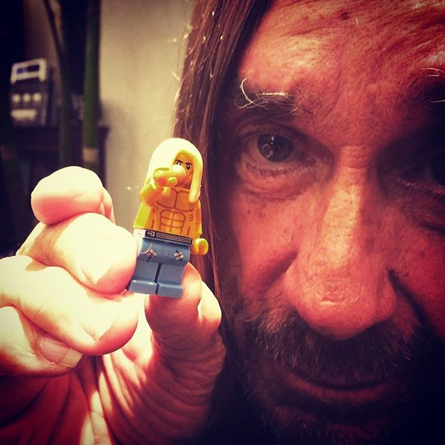 Iggy Pop holding his Lego figure.