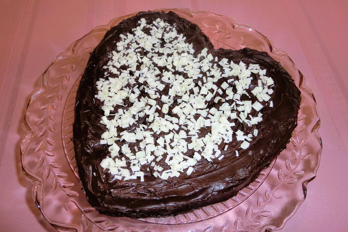 Chocolate heart cake with chocolate frosting to wish everyone a #HappyValentinesDay2026  and a #HappyWeekend!  White chocolate shavings decorate the top of the cake!  #Homemade and #delicious