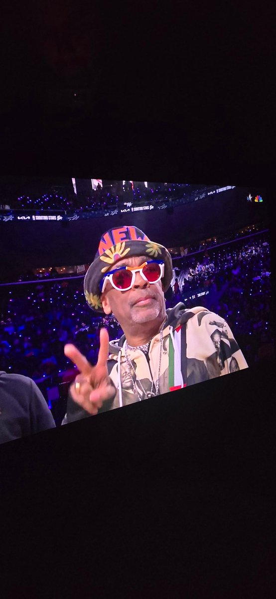 Spike Lee at the All Star Weekend. Wearing a bag with the palestinian flag and a keffiyeh on it. 
King shit.