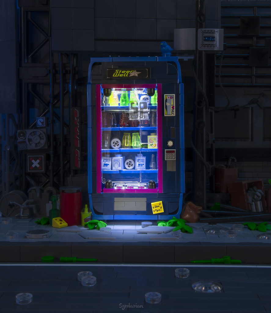 Cyber Vending Machine for the Iron Forge contest by @syrdarian_ 
A tasty choice build brought to you by RebelLUG member, Marc. Can you guess the seed part and find them all? Used 20 times in blue, once in LBG, once in black. 
#ironbuilder  #seedpart #lego #cyberpunk