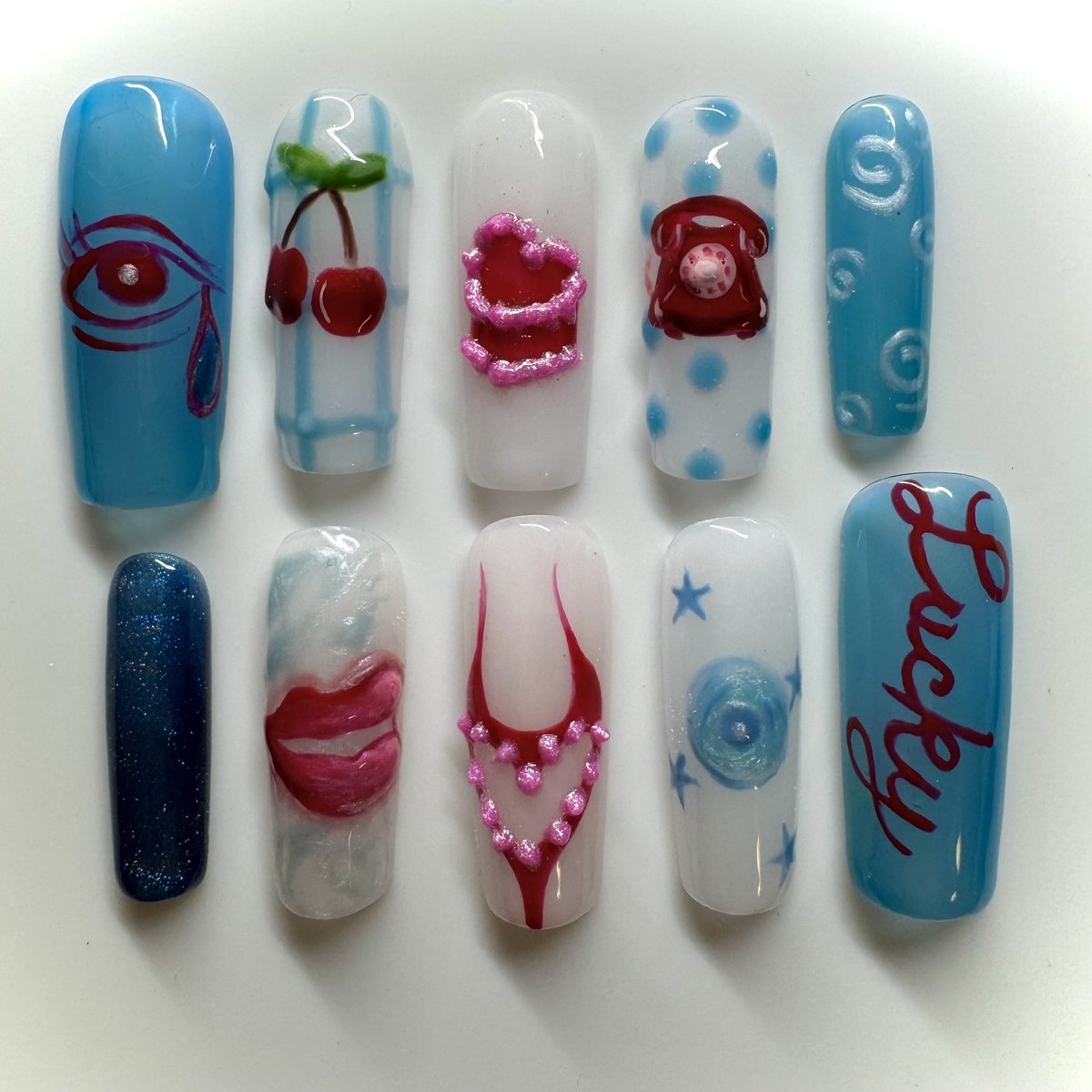 doperthnurnails's tweet photo. lucky me💿👄✨🍒 blue y2k valentine’s nails🩵 https://t.co/ZQFg8XUr6D