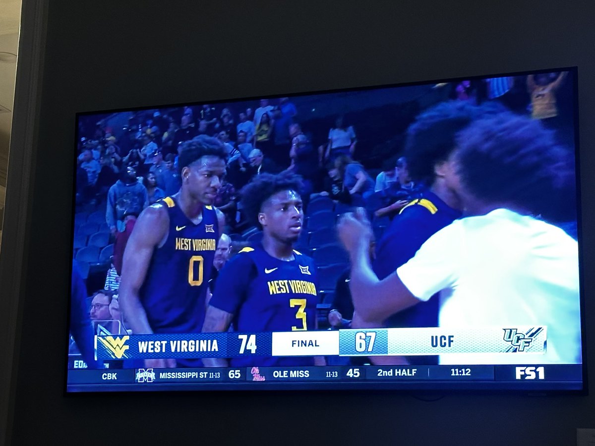 michaeltbenson's tweet photo. The Mountaineer faithful were in full force tonight to cheer on @WVUhoops @WestVirginiaU 

What a win!! #HailWv https://t.co/wsJDuiUUKP