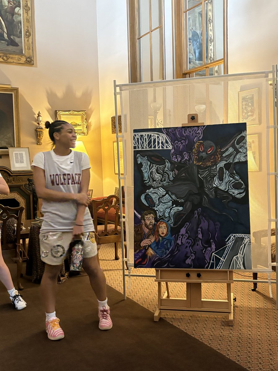 SIWolfpackBKG's tweet photo. Supporting each other both on and off the court. We took a mini field trip to view the artwork of a teammate. Kaylee will be competing in the IHSAE art competition with her piece “Moth Man”. https://t.co/qY0lyUSqXn