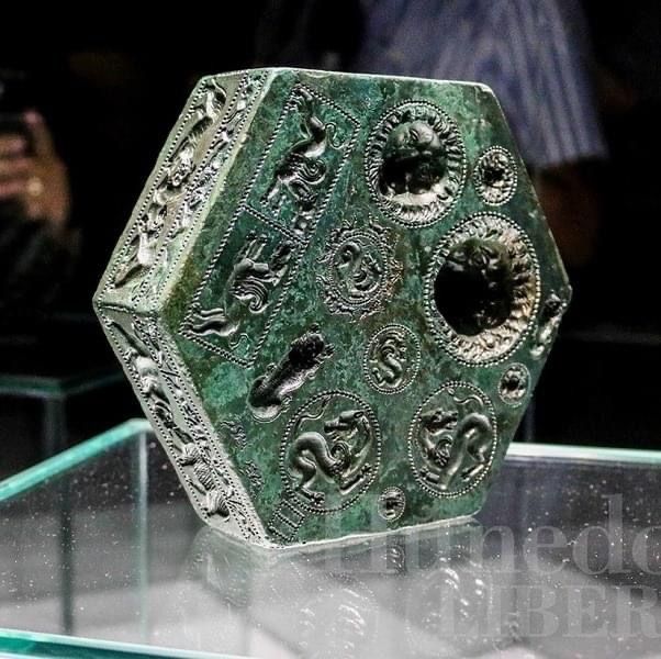 The 2,000-year-old Geto-Dacian bronze matrix, discovered in 2013 at Sarmizegetusa Regia, Romania, is a 8.24 kg, 5 cm thick, eight-sided artifact used for crafting intricate jewelry and medallions. It features 112, or according to some, fewer, detailed images of real and mythical