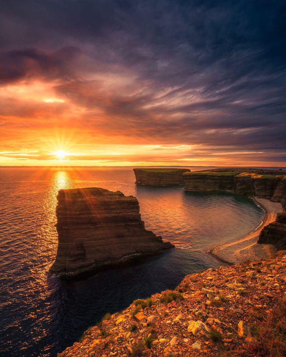 A vibrant sunset at The Bell on Bell Island Newfoundland, Canada.