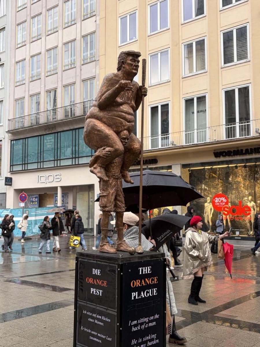 The “Orange Plague” sculpture by Danish artist Jens Galschiøt, in Munich, Germany.