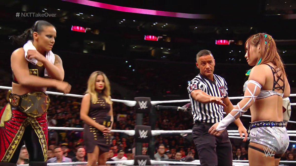 its crazy how the best professional wrestler in this image is the one wearing the referee shirt