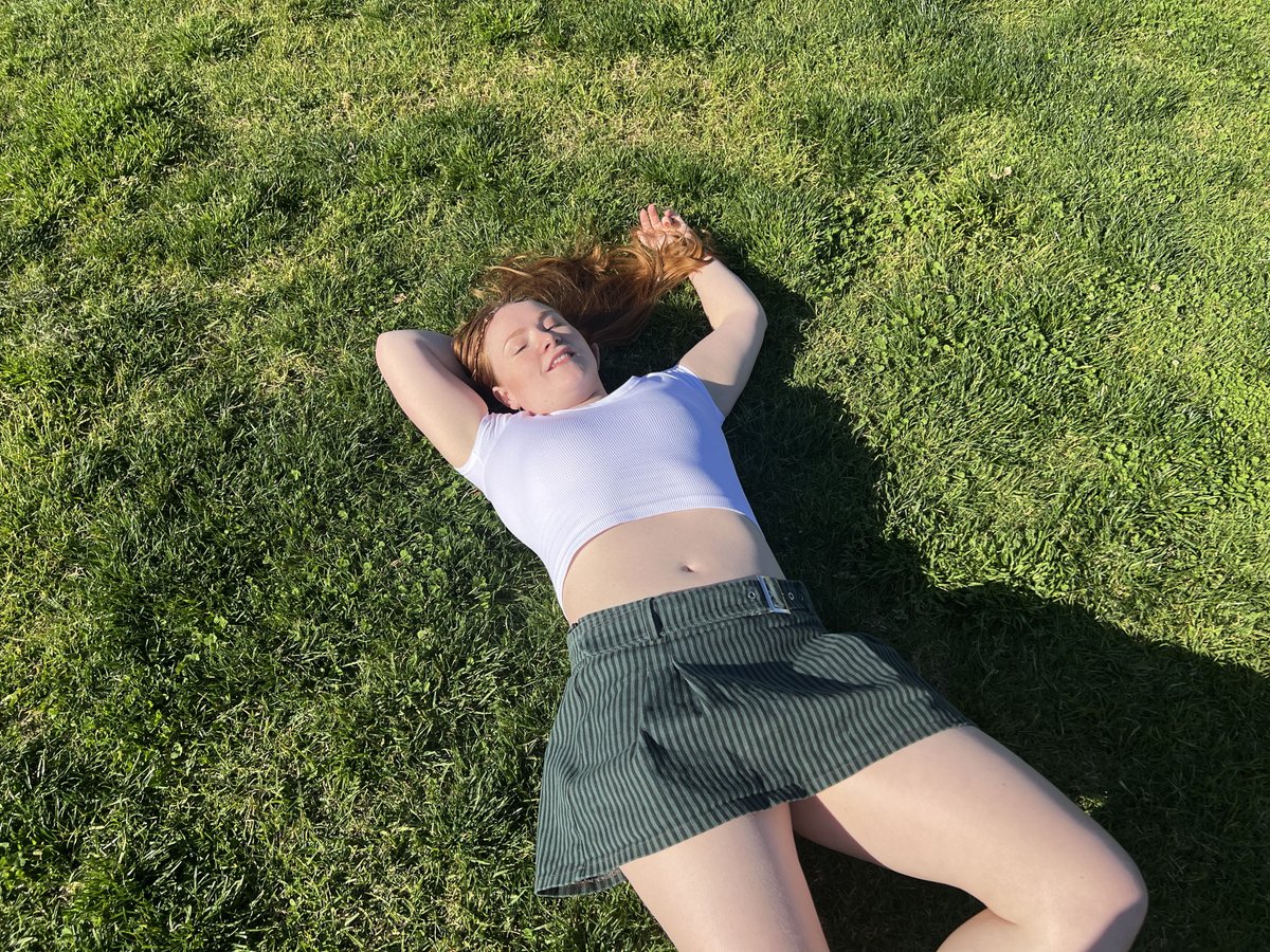 Sunday fun in the park, golden hour glow. Fresh cut grass under bare feet, earthy scent mixing with sunscreen and sweat. Pure bliss, wanna strip down and roll in it. Come over babe, lay skin on skin under the sun. Who's joining? 🌿☀️🍃