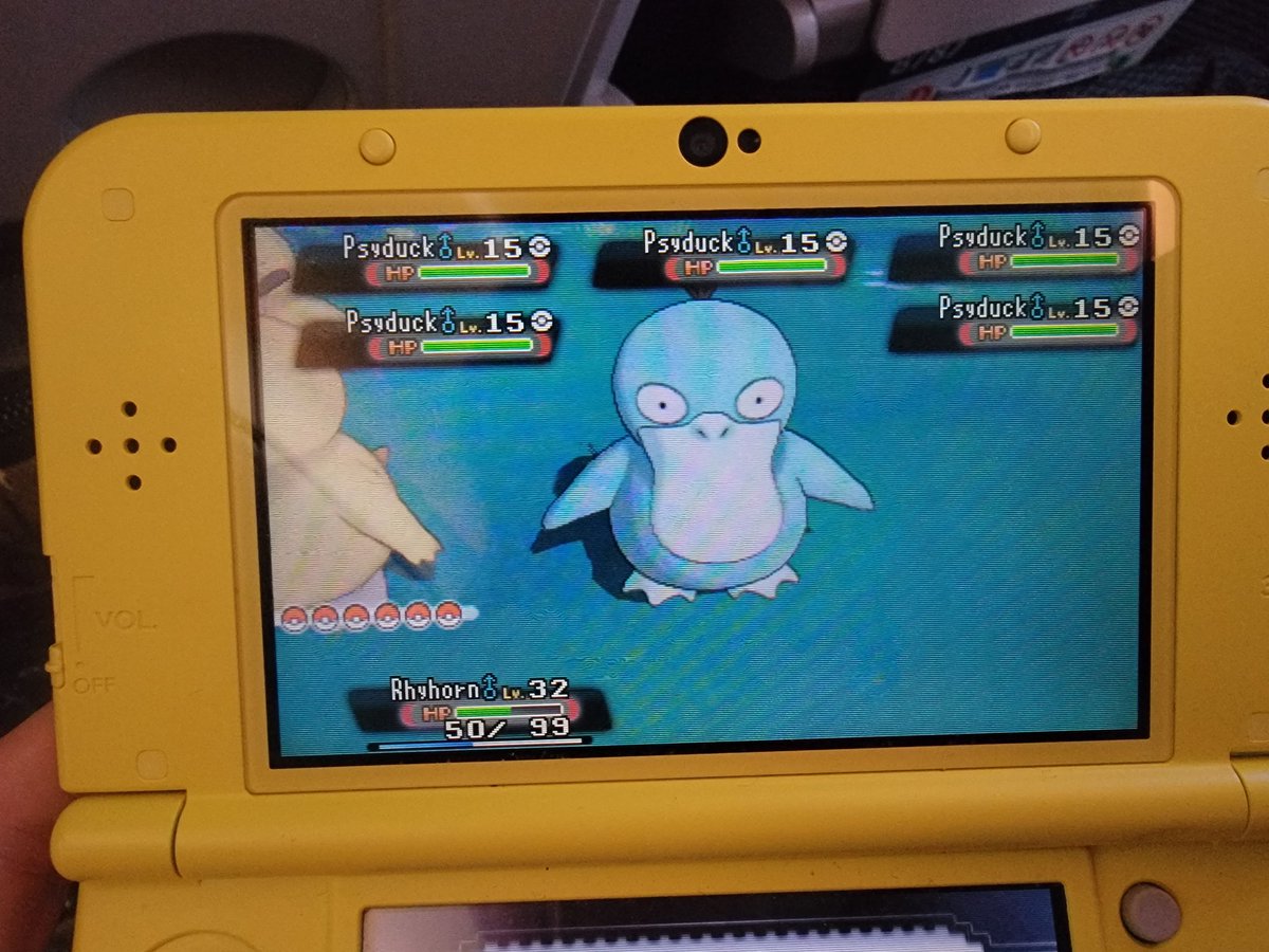 Pyroar's tweet photo. Found a shiny Psyduck while on the flight to Tokyo! We landed yesterday evening, and I can't wait to show my partner the nearby Pokémon Centers! 💙✨️ #Maxadventures https://t.co/4QLwEXK0tO