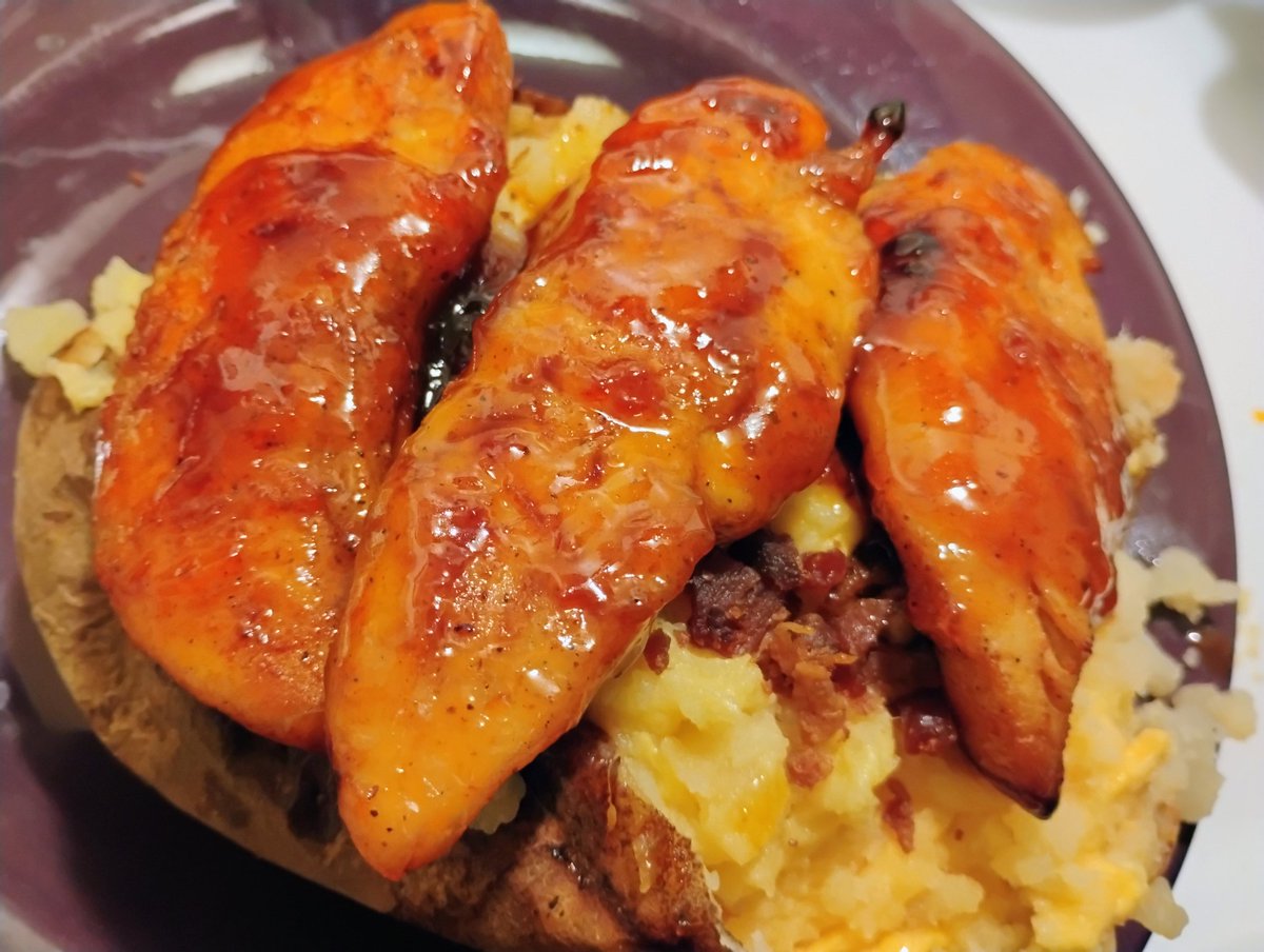 I am an evil genius 
Stuffed loaded baked potato 
With hot honey tenders 
AKA the big back potato AKA 
Nap time 😴