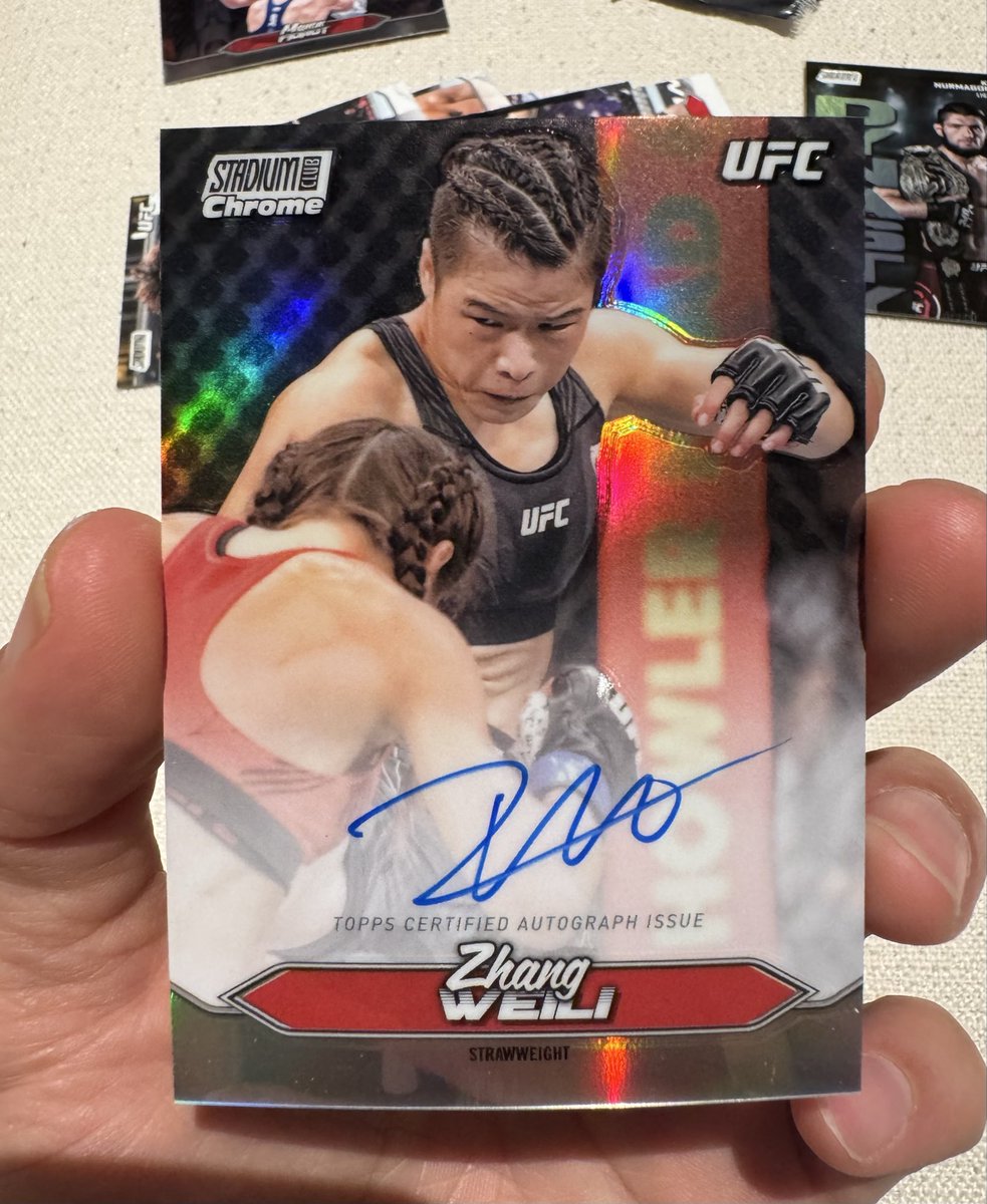 CluelessCardGuy's tweet photo. Hits from my latest 2 packs… pulled my first auto of the bix.. a solid chrome of @MmaWeili  

And a Dynasty rainbow refractor(?) of Khabib &amp; a photographer’s proof… which I don’t know much about? @CardPurchaser anyone know about these?

#StadiumClubUFC #zhangweili https://t.co/00ZLW85gIt