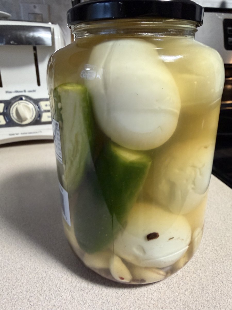Eggs in the jar, apple cider vinegar and white vinegar used. A few jalapeños and coupe habanero’s thrown in. And lots of garlic.