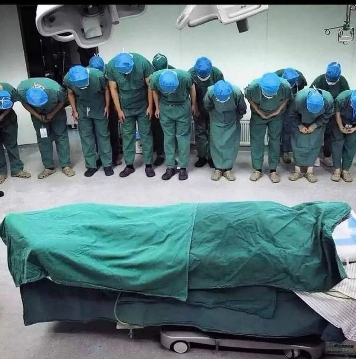 sciencegirl's tweet photo. Medical staff pause to bow in tribute to a young female organ donor, honoring her selfless gift that went on to save multiple lives.

We are temporary, but the good we leave behind is permanent https://t.co/cCv339q3Jd