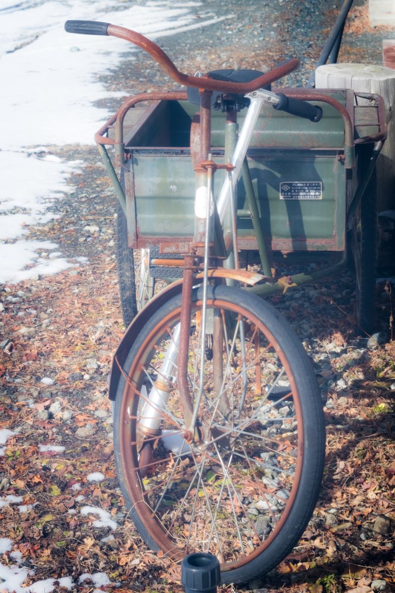 An old, rusty tricycle with a retro look