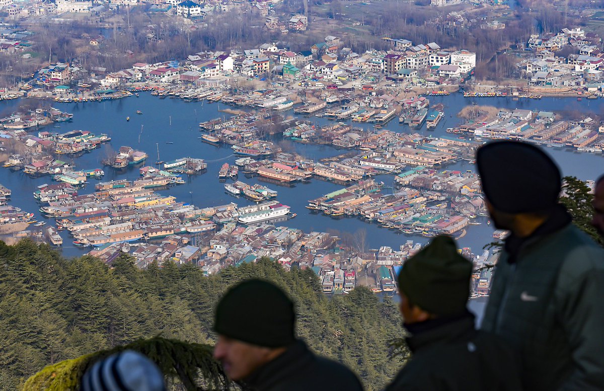 RisingKashmir's tweet photo. In Pics: An aerial view of the #Srinagar city and the #houseboats from the top of a mountain in Srinagar on Monday. (ANI Photo) https://t.co/ZEcKhEK3e1