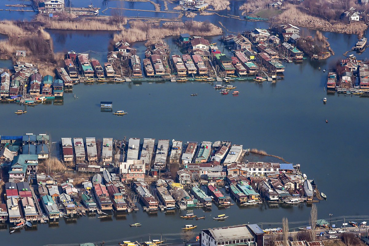 RisingKashmir's tweet photo. In Pics: An aerial view of the #Srinagar city and the #houseboats from the top of a mountain in Srinagar on Monday. (ANI Photo) https://t.co/ZEcKhEK3e1