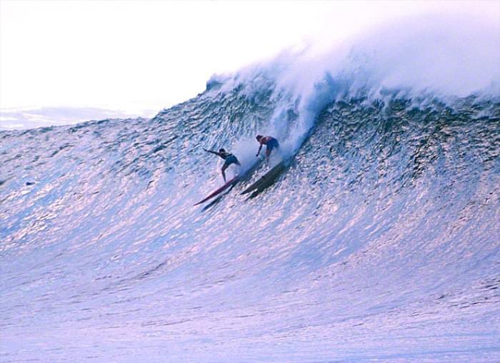<a href="/KimKatieUSA/">Kim "Katie" USA</a> Haunting music matching the overcast scene. Beautiful flow motion. By going right the surfer escaped the maelstrom on the inside of the left. The jetski assist has completely changed the metrics of big wave surfing. Here’s a nice shot of Waimea in the 70’s. No jetski, no leash,