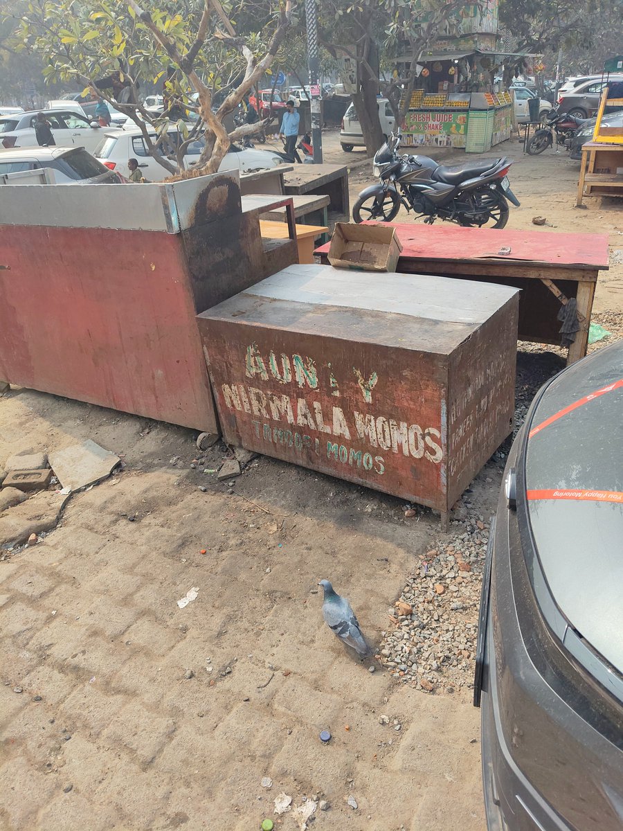 Colatul's tweet photo. @YamunaAuthority @UPGovt @CMOfficeUP Yamuna Authority office boasting signing international agreements is balancing out brazen display of poverty &amp; deprivation right at it's entrance. The officials are so committed that they have no time seeing outside car window s. Development  Authority??? https://t.co/iqWXmWtGM6