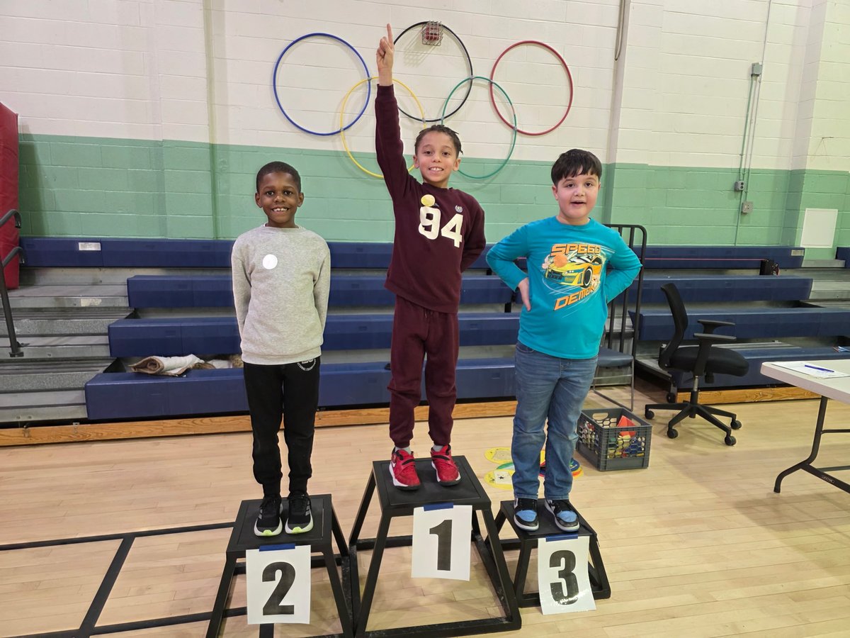 JohnAdamsElem's tweet photo. In PE, students have been learning about the Olympics and the sport of curling with daily head-to-head tournaments. Students win gold, silver, or bronze medals and get to stand on the podium with th Olympic rings displayed on the wall. 🥇🏅🥌 #curling #BeEager #PE4thewin @ACPSk12 https://t.co/wyHUcHTuEN