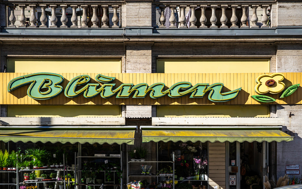 GDR era neon signs along Karl-Marx-Allee in East Berlin.