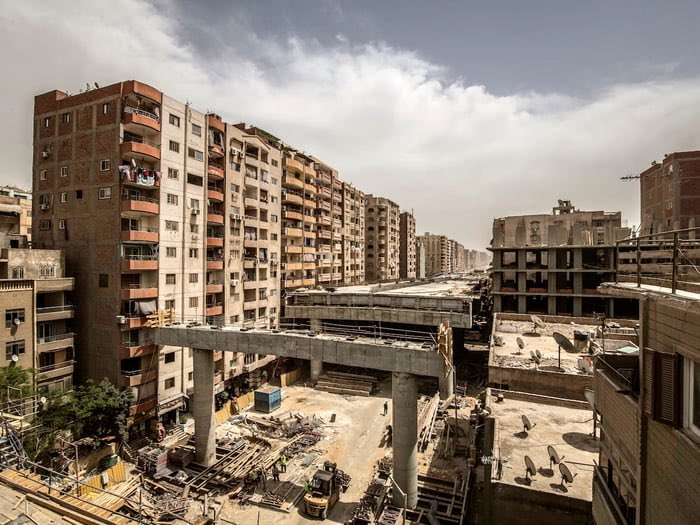 MyLordBebo's tweet photo. The owner of these buildings built them on land owned by the government. When the government wanted to use this land to build a bridge, they discovered the issue but chose not to fix it.

They essentially said, “OK, we won’t demolish the buildings, but the people will have to suffer living just a few centimeters from the bridge.”