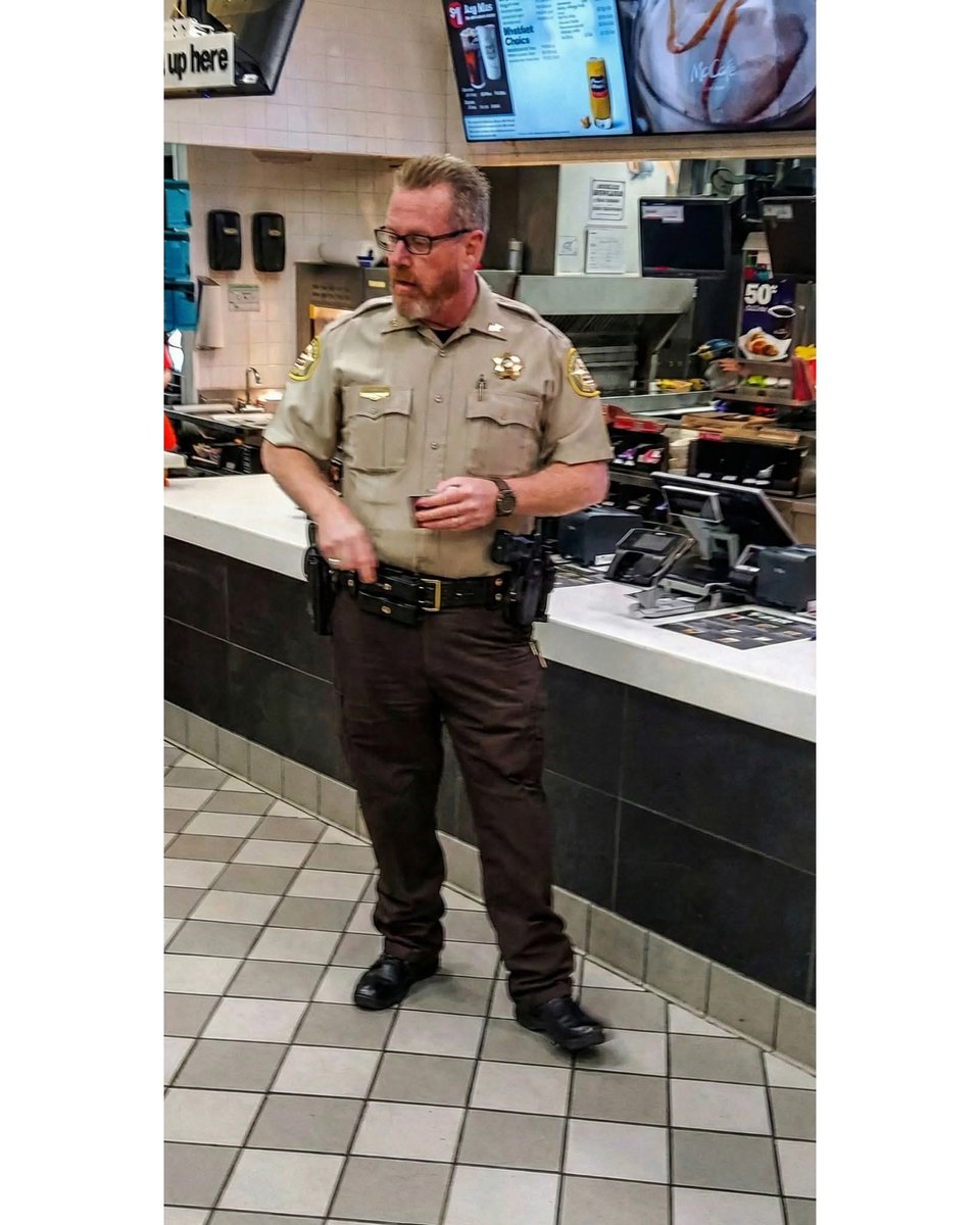 I was standing in line at the McDonald's (Pilot Flying J) in Cartersville, placing my order, when this deputy and a man (who appeared to be homeless) walked in and got in line behind me. After I ordered, I stepped back and watched the homeless man place his order. The deputy then