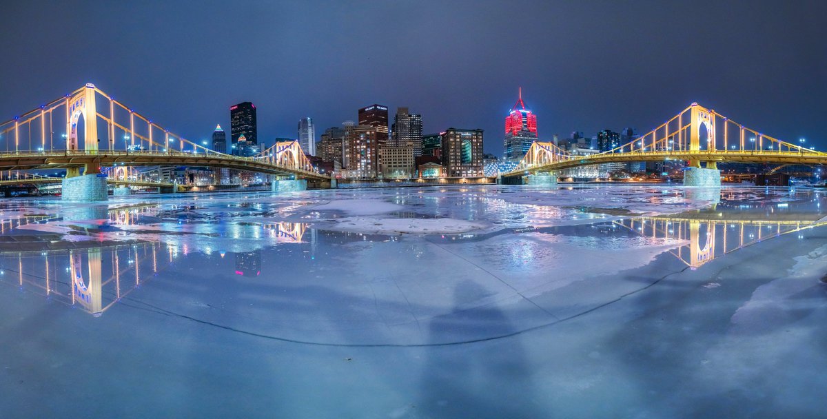 A panorama from the North Shore of #Pittsburgh last week when we had that really warm day and there were puddles all over the frozen rivers. Pretty cool how that huge crack in the ice connected the bridges as well, which you can see perfectly reflected in the puddles.