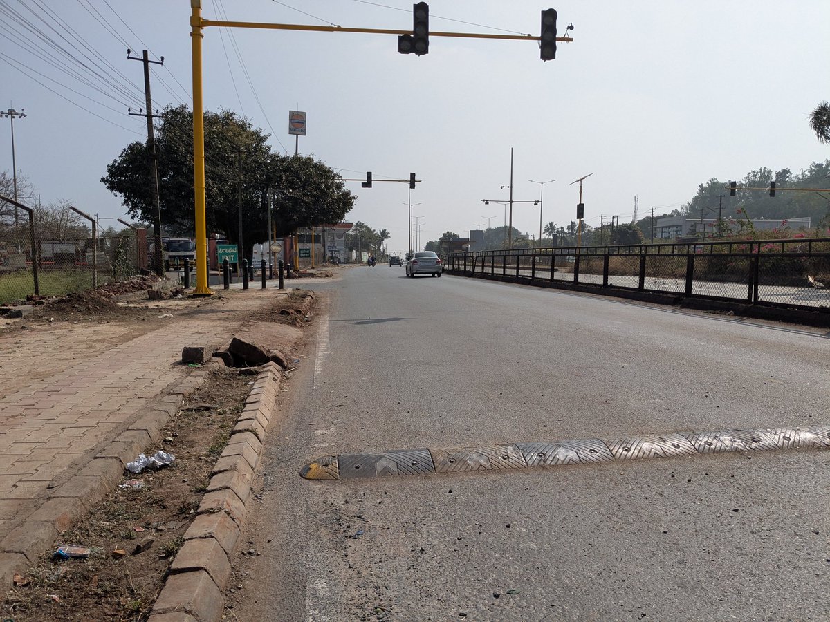 varungrao's tweet photo. Unscientific road humps on Hubballi-Dharwad BRTS mixed lane !!

None of these humps comply with Indian Roads Congress (IRC) standards that mention parabolic shape, height should be 0.1m and 3.7m width for an advised speed design of 25kmph. The humps on main roads are strictly limited as per IRC standards.

The authorities have installed the humps without following IRC standards.

As per the media reports, police advised BRTS Limited to put humps. But BRTS has put unscientific humps without marking, non parabolic that doesn't follow IRC standards.

These unscientific humps are a threat to the commuters. Unscientific hump has already taken two lives in Feb 2025 at Arts college junction.

The hard rubber hump at IOCL junction in Rayapur is the most dangerous hump. This hump can easily cause an imbalance to two wheelers. (Pic 2)

I request the concerned authorities to correct these unscientific humps and make it as per IRC standards.

@compolhdc @HDCityTraffic @hd_brts 

FYI @osd_cmkarnataka