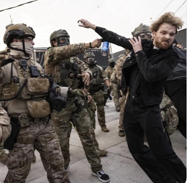 This photo deserves a Pulitzer because it shows Federal agents shooting the Pastor of the First Presbyterian church in Chicago with rubber bullets in the head and spraying him with tear gas in the face when he was just there to pray with everyone!