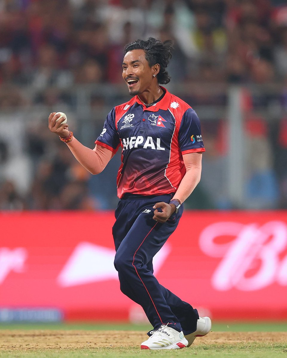 ICC's tweet photo. 𝐁𝐥𝐢𝐧𝐤 𝐚𝐧𝐝 𝐲𝐨𝐮 𝐦𝐢𝐬𝐬 𝐢𝐭 🤯

Sompal Kami snares a stunning caught-and-bowled against Scotland at the #T20WorldCup 🔥

Watch the moment unfold 👉 https://t.co/t7palLt3xd

Tournament broadcast details 📲 https://t.co/NPykWM7qqY https://t.co/pYNjcPzD2v