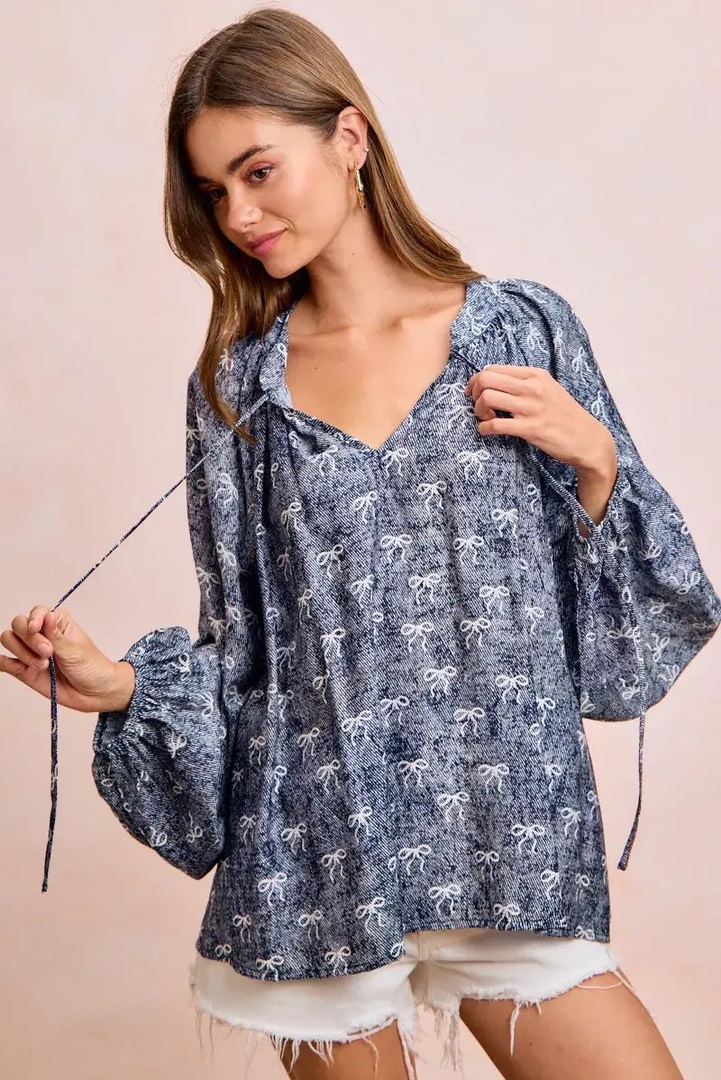 amomentofnow's tweet image. New arrival! ✨ Navy Blue Ribbon Bow Print Top with balloon sleeves is a playful statement piece. Pair with simple bottoms. Comfortable rayon-nylon blend. Try it: amomentofnow.com/products/bibi-… #Fashion #NewArrival #StatementTop